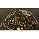 A silver bangle, by Silvarious, marked 925; other sterling silver jewellery, an amber necklace and