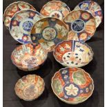 Oriental Ceramics - a 19th century Japanese Imari dish, decorated with panels of flowers and