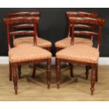 A set of four George/William IV mahogany dining chairs, curved bar backs, stuffed-over seats, turned