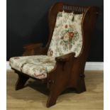 A 17th century style oak lambing chair, probably Nigel Griffiths 'Monastic Woodcraft', 99cm high,