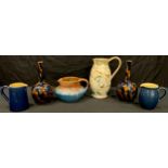 A Bourne Denby Danesby Ware Orient glaze Ilam jug; a pair of Denby majolica bottle vases; a Glyn