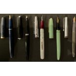 A Platignum fountain pen with a 14k gold nib, Iridium pointed; four other fountain pens, including