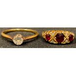 An 18ct gold ruby and diamond chip ring, size J, 3g, marked 18, original box; an unmarked gold ring,