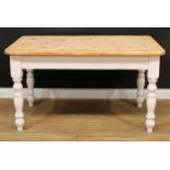 A Victorian style pine farmhouse kitchen table, rounded rectangular top, turned legs, 77.5cm high,