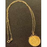 A George V gold half sovereign, 1914, mounted in 9ct gold as a pendant with necklace chain, 5.6g