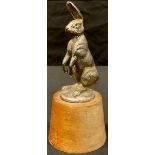 Automobilia - an Alvis car mascot modelled as a hare, mounted on hardwood base, 16.5cm high overall