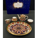 A Royal Crown Derby Imari palette 1128 pattern miniature tea set on tray, comprising teapot, milk