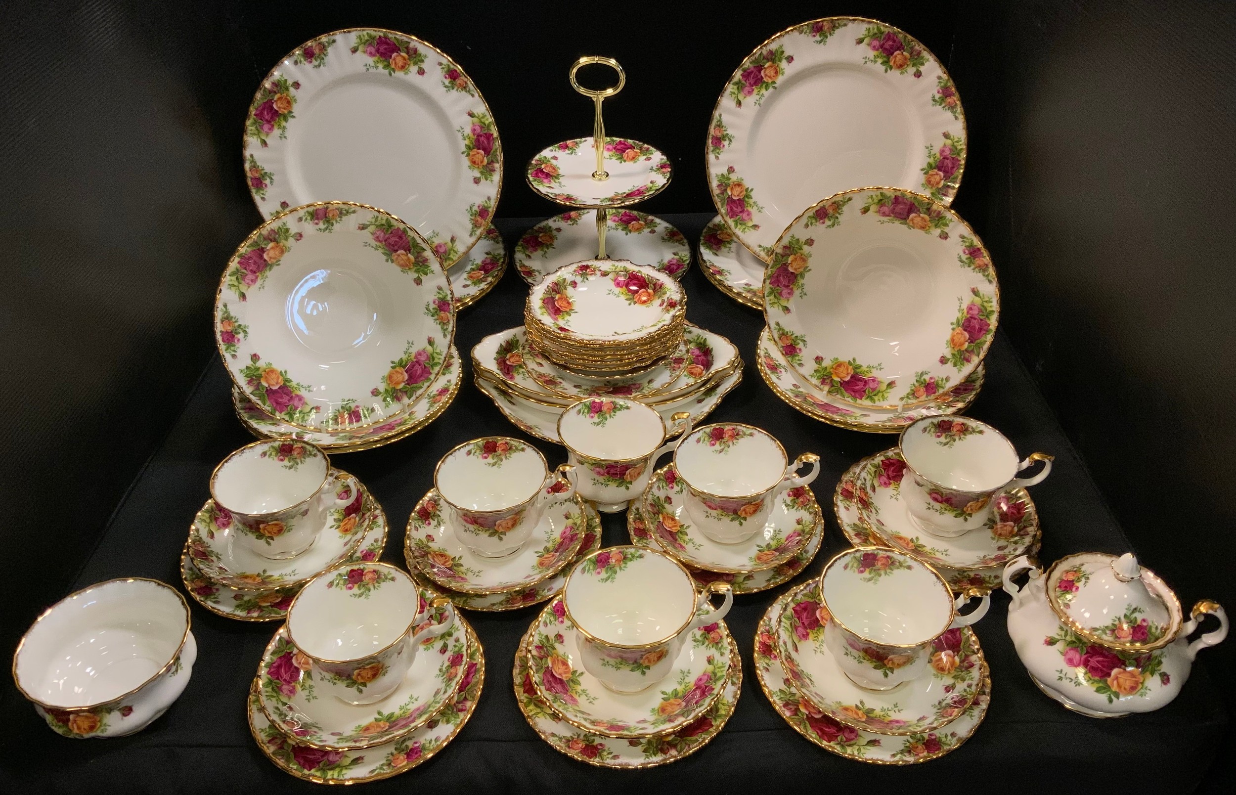 A Royal Albert Old Country Roses tea service, for eight, including two tier cake plate; serving