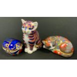 A Royal Crown Derby paperweight, Standing Cat, gold stopper, boxed; others, Catnip Kitten;