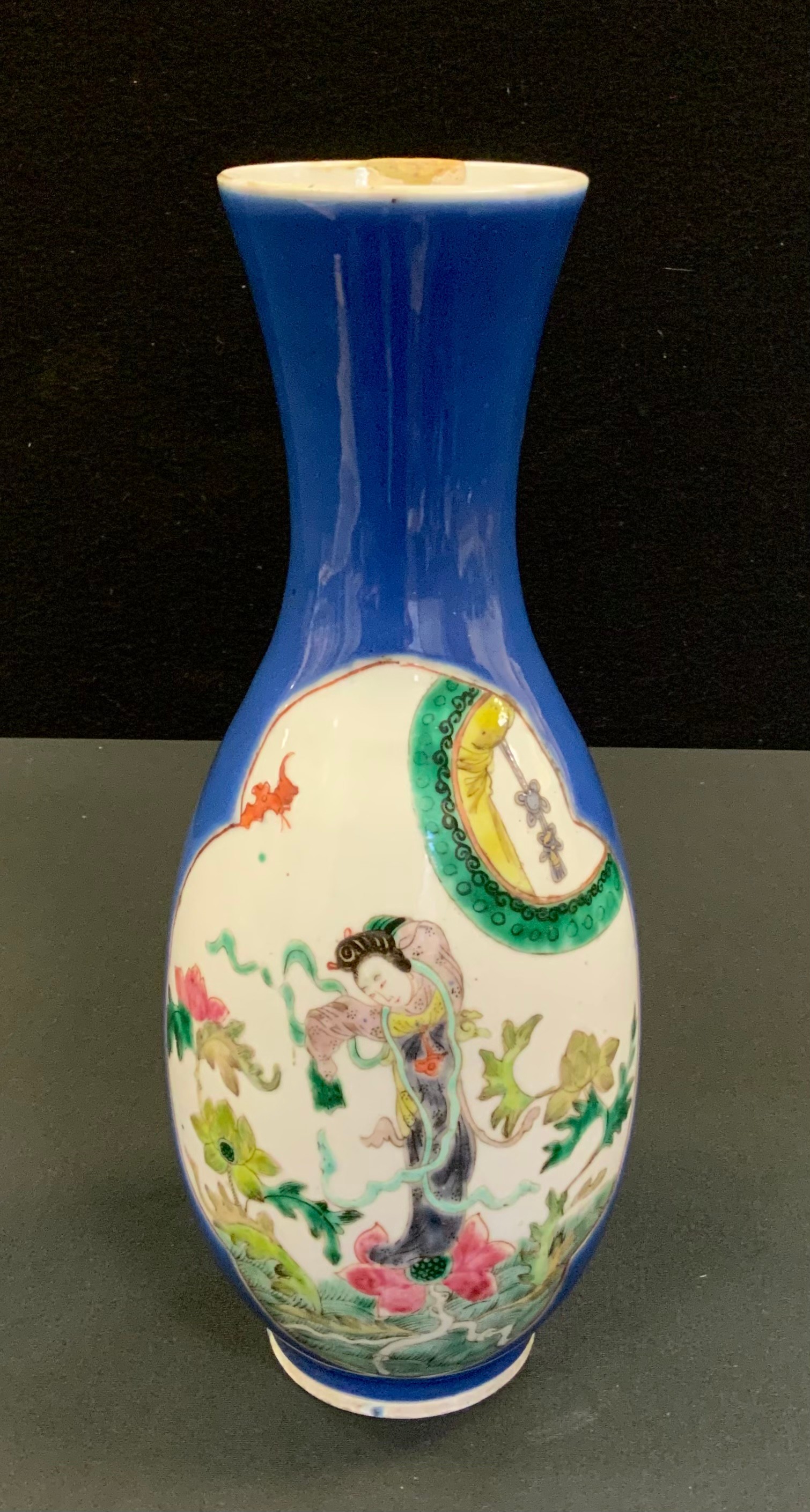 A Chinese slender ovoid vase, decorated with two shaped cartouches each with oriental figures and