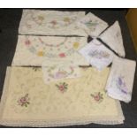 Hand embroidered linen table cloths, including crinoline lady, English country flowers, etc