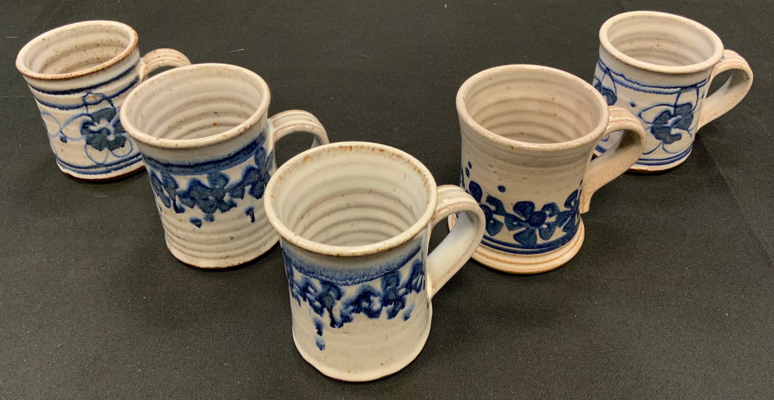 A mid 20th century Laceby Studio pottery (David Morris) ringed cup, decorated with flowers;