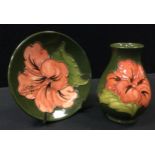 A Moorcroft Hibiscus pattern vase, 9.5cm high; similar trinket dish, 11.5cm diameter, green