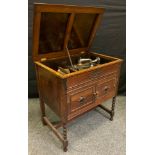 An early 20th century gramophone, in oak cabinet, turned legs, 69cm wide, c.1930