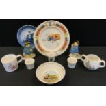 A Wedgwood Peter Rabbit nursery ware; Coalport Paddington the Chimney Sweep; another, Paddington