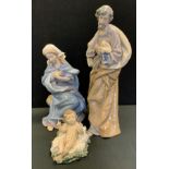 A Lladro figure Virgin Mary, model no 1387; others Joseph and Baby Jesus, printed marks, two