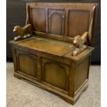 A mid 20th century oak monk's bench, 95cm wide, c.1950