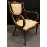 An Aesthetic movement walnut and mahogany parlour chair, shield-back with inlayed and pierced splat,