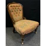 A late Victorian mahogany button-back nursing chair, turned legs, ceramic casters, c.1890.