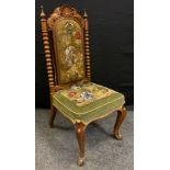 A Victorian walnut side chair, anthemion cresting, arched beaded and tapestry back and stuffed-