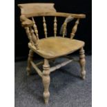 An early 20th century Elm wood Smoker's Bow arm chair, c.1900-1920-.