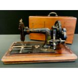 A Faudels of London sewing machine, inlaid case