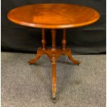 A George Honeyball circular mahogany occasional table, 59cm tall x 66cm diameter.