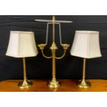 Lights and Light fittings - A three branch brass table lamp, 55cm tall; a pair of brass