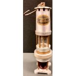 An unusual J H Naylor ltd Spiralarm type S miner`s lamp with red warning lamp base, 36.5cm high.