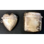 An Edwardian silver heart vesta case, Birmingham 1903; another rounded rectangular, 61.9g (2)