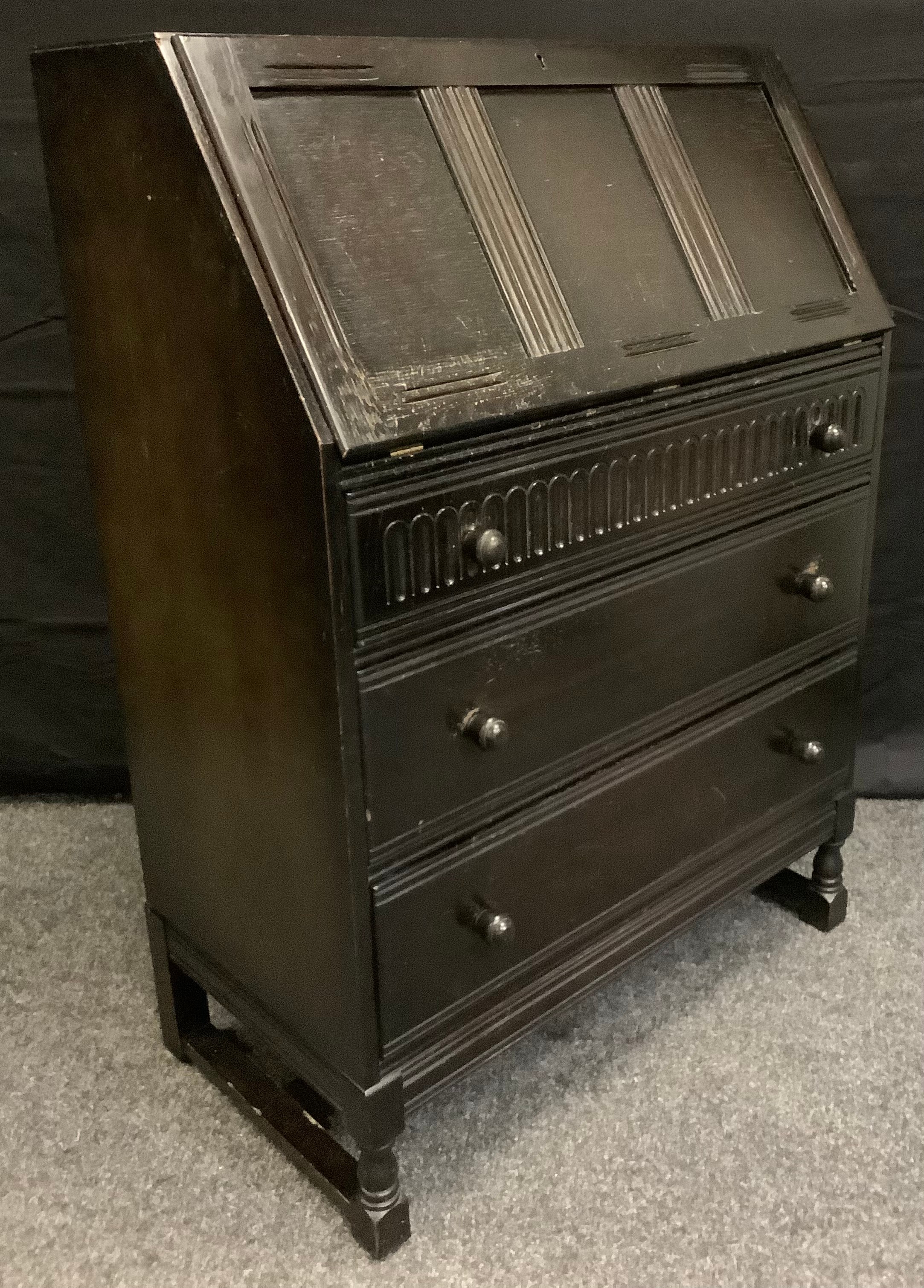 A 1970's oak bureau.