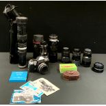 Photography equipment - A Praktica Super TL 35mm SLR camera, with Carl Zeiss Tessar 50mm f/2.8 lens;