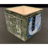 A Troika square vase, incised and in relief with geometrical motifs, 8cm high, monogrammed for