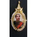 A gold coloured pendant, tests at 14k, with portrait of King of Siam Thailand Chulalongkorn,