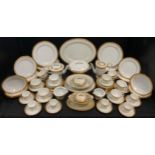 A Noritake dinner, tea and coffee service, for eight, banded in gilt,