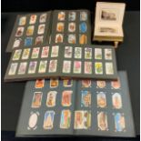 Cigarette and tea cards - two player Navy Cut albums, cards mostly Wills inc Regimental Badges,