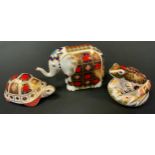 A Royal Crown Derby paperweight, Imari Elephant, silver stopper; Tortoise, second; another, Imari