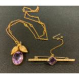 A 9ct gold amethyst pendant necklace, twin leafy mount inset with a single oval amethyst,