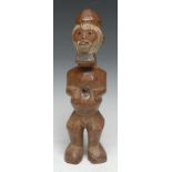 Tribal Art - a Teke reliquary power figure, stylised features picked out in white pigment, abdominal