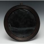 A 19th century convex looking glass, the mirror plate within a reeded border, 25cm diam