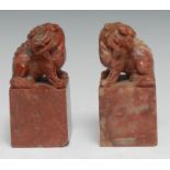 A pair of Chinese soapstone desk seals, each carved with a temple lion, 10.5cm high