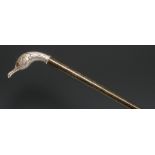 An early 20th century silver coloured metal mounted novelty walking stick, the handle as the head of