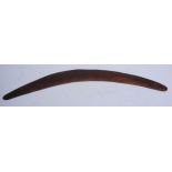 Tribal Art - an Australian Aboriginal boomerang, each end scratched with three band motifs, 62.5cm