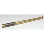 A lacquered brass three-draw pocket telescope, 14.5cm extending to 41.5cm long