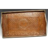 An Indian hardwood and marquetry gallery tray, profusely inlaid in copper and brass with leafy