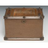 A late 19th century oak fall front humidor cigar cabinet, the hinged cover with pressed panel