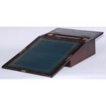 A George IV rosewood writing box or lap desk, the crossbanded top with hinged cover and fall