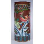 A tall Chinese Yixing cylindrical brush pot, decorated in raised enamels with phoenix, flowers and