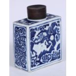 A Chinese porcelain rectangular tea caddy, moulded and painted in tones of underglaze blue with