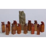 A set of twelve Chinese soapstone seals, each carved with a stylised beast, 6.5cm high; another,